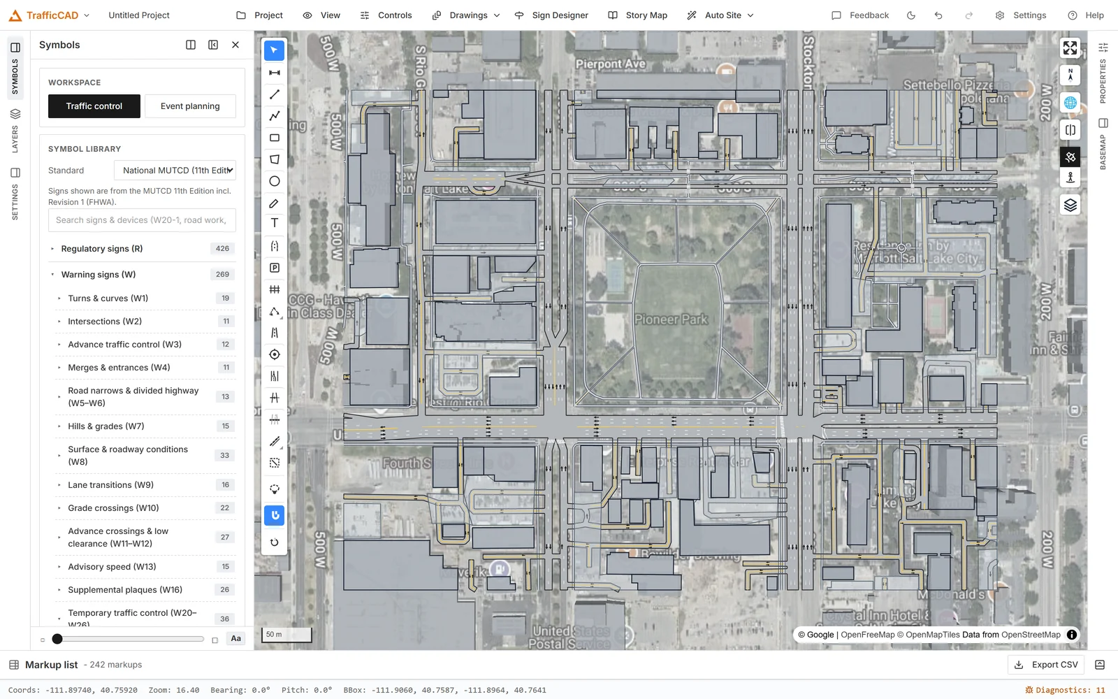 TrafficCAD Auto Site: a downtown block vectorized into editable road, building, and parking layers over live satellite imagery.