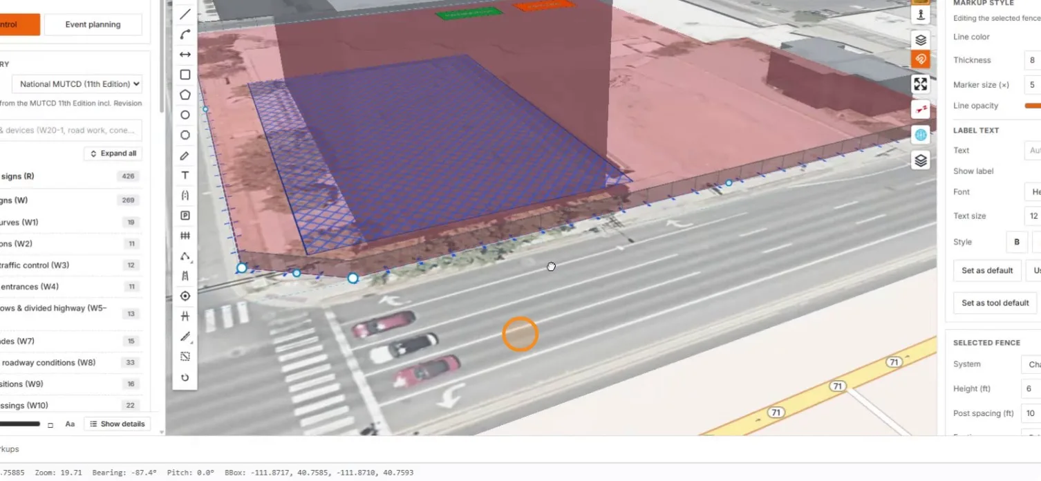 The chain-link fence standing in 3D around the red-tinted site