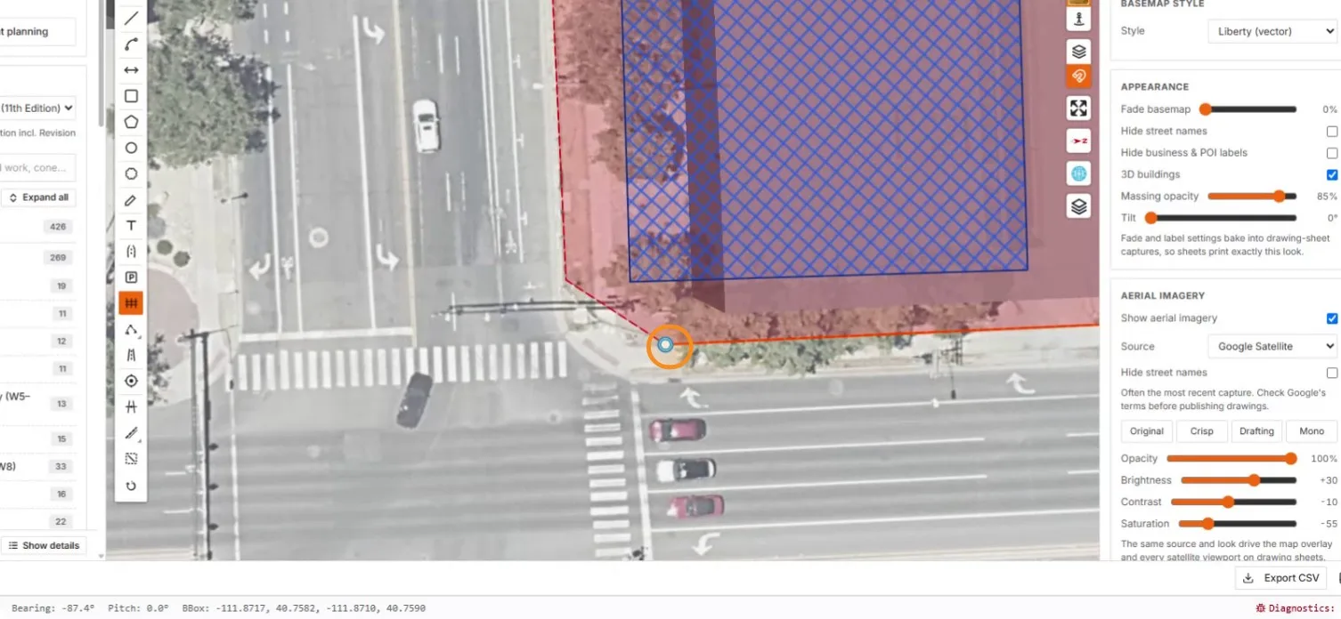 A fence vertex at the street corner by the crosswalks